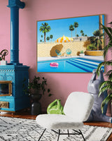 An inviting space featuring a captivating pool scene artwork with a yellow and white striped umbrella and a pink inflatable pool ring floating in a refreshing swimming pool on a sunny day in Palm Springs