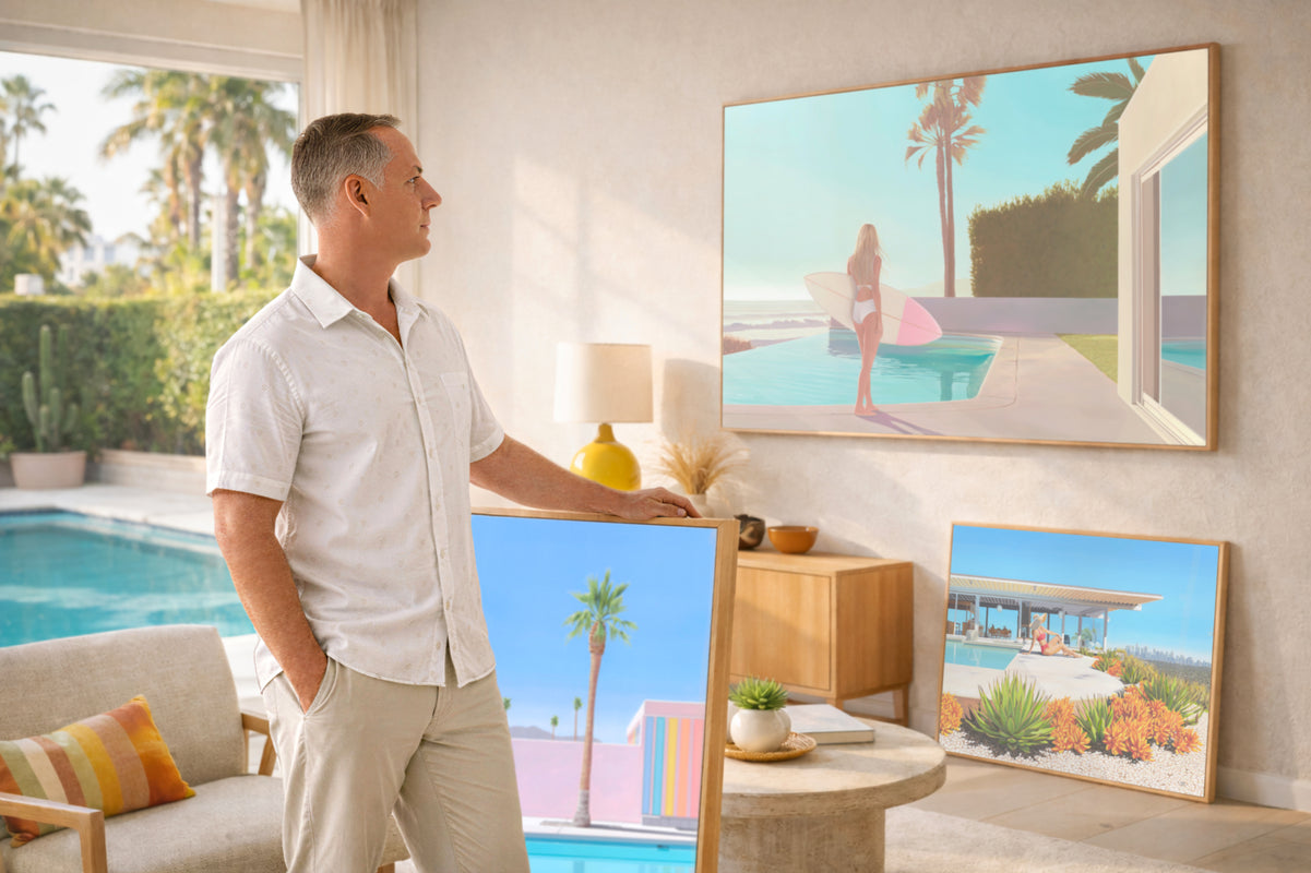 Jarrod standing in a living room with a large Canvas Print displaying a scenic pool view.