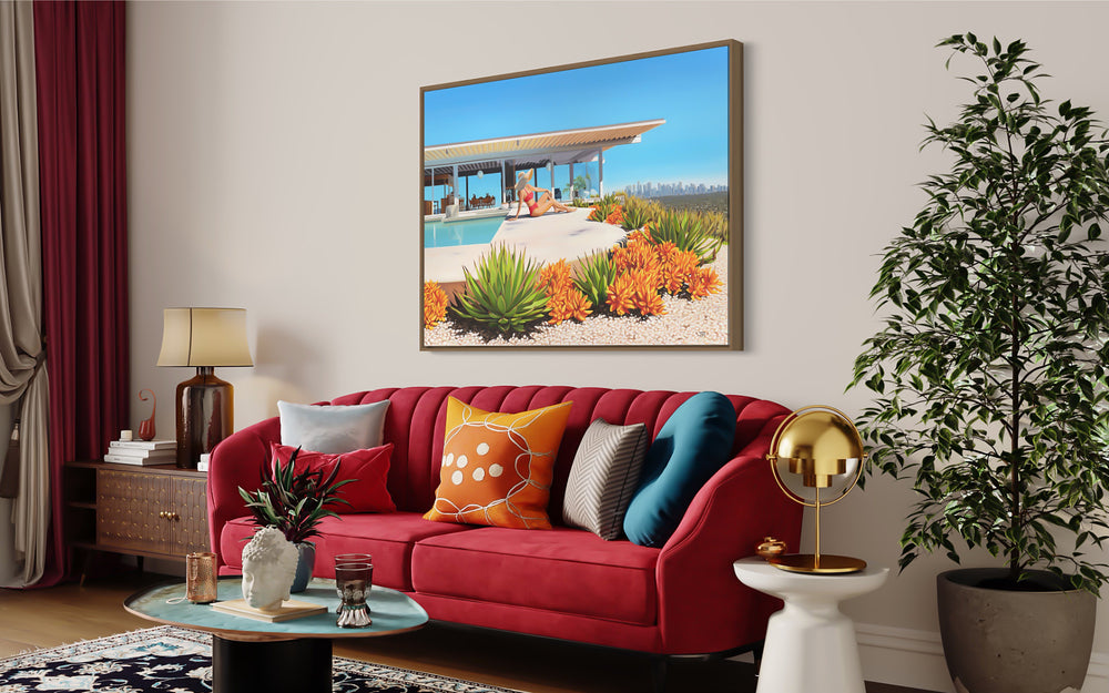 Woman in vibrant bikini relaxing pool side at famous mid-century home