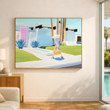 Framed artwork of a colorful scene with a person on walking to a pink door, displayed in a modern living room.