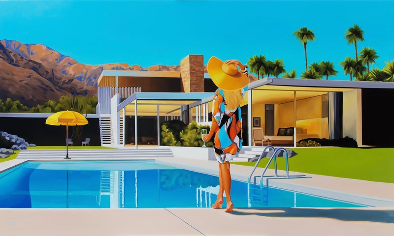 A beautiful scene captured in art: a woman in a wide-brimmed hat and summer dress relaxes by the pool with a cocktail, while the Kaufmann house and a yellow umbrella add to the ambiance