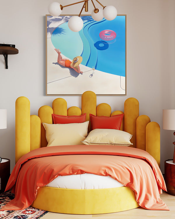 A dreamy bedroom with an alluring artwork of a woman relaxing in a beautiful pool with a pink pool float and a refreshing cocktail