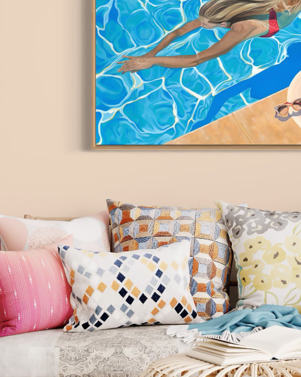 A beautiful piece of art in a stylish living room depicting a young girl enjoying a swim in a colorful bikini