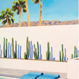 The perfect balance of fun and serenity, as pool floats add a pop of color to a tranquil Palm Springs swimming pool