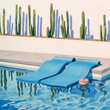 An inviting scene of leisure and luxury, as pool floats await a dip in the crystal-clear waters of a Palm Springs oasis