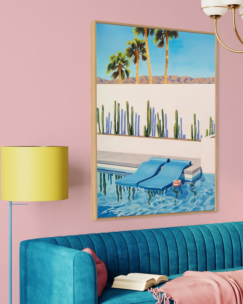 This stunning artwork captures the serene beauty of a Palm Springs swimming pool, complete with colorful pool floats